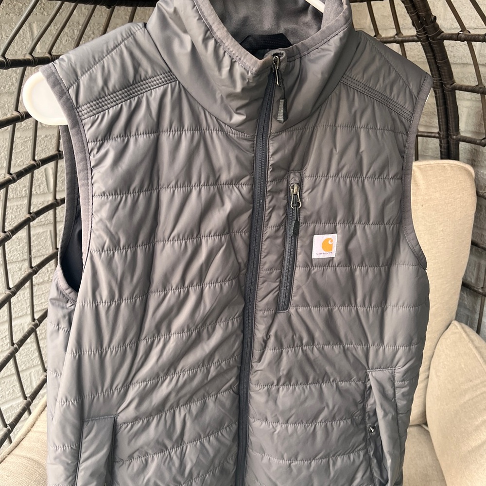 Women’s relaxed fit vest. Zippered with pockets. Packable, warm.